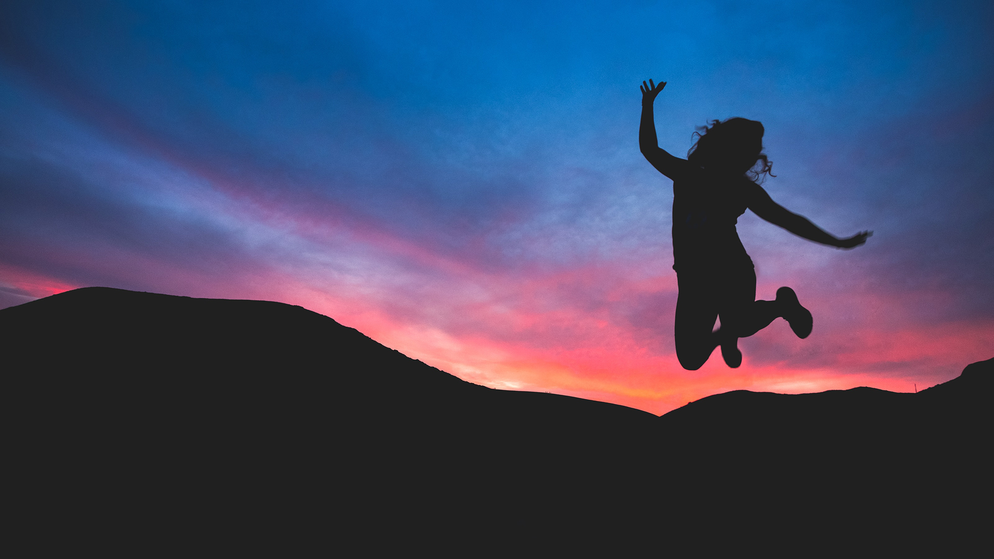 woman jumps for joy